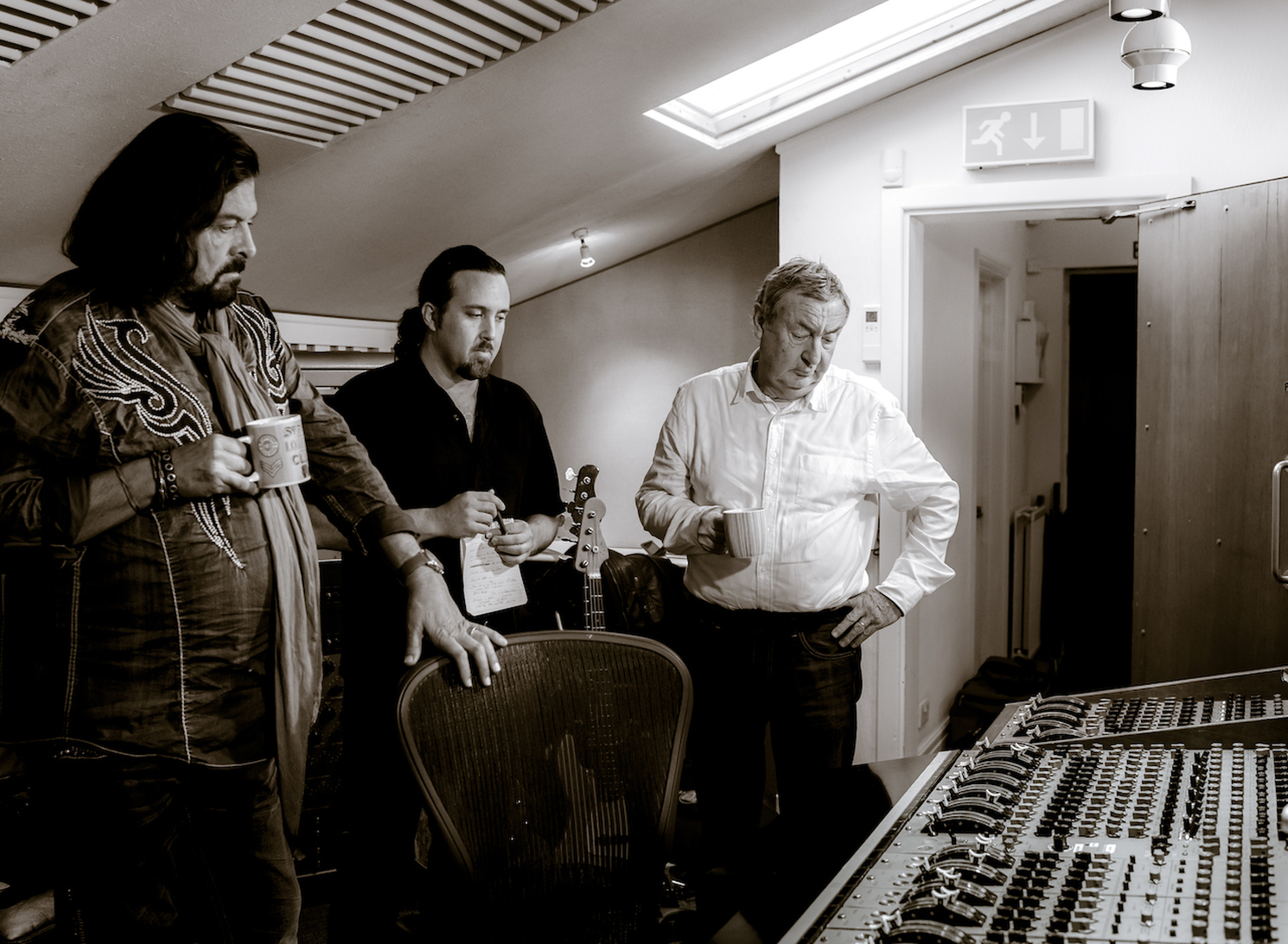 Alan Parsons, Dave Kerzner and Nick Mason listen to a playback recorded on the vintage EMI mixing console
